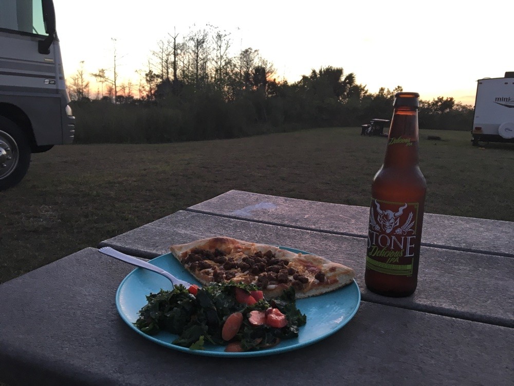 pizza and beer at sunset at monument lake