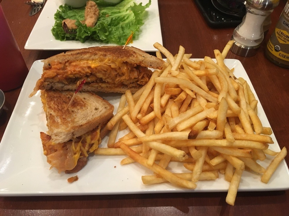 tempeh reuben with a load of fries at loving spoonfuls.