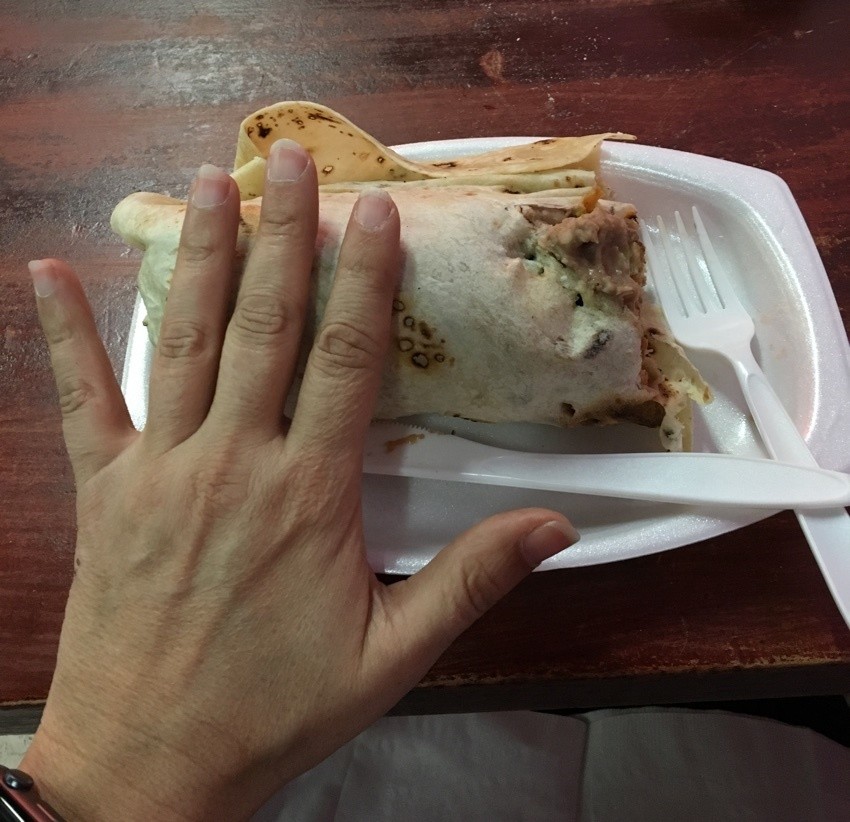hand to show size of burrito at tanias 33.