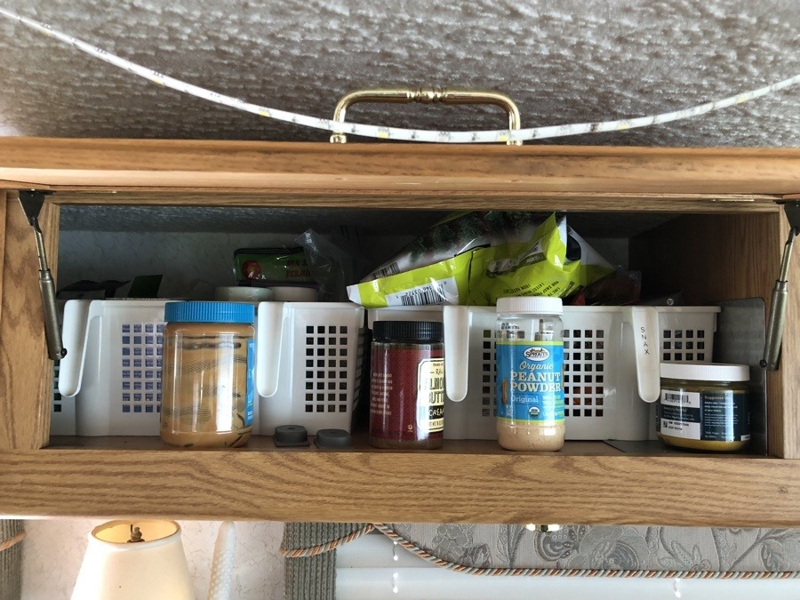 upper cabinet bins in RV kitchen.