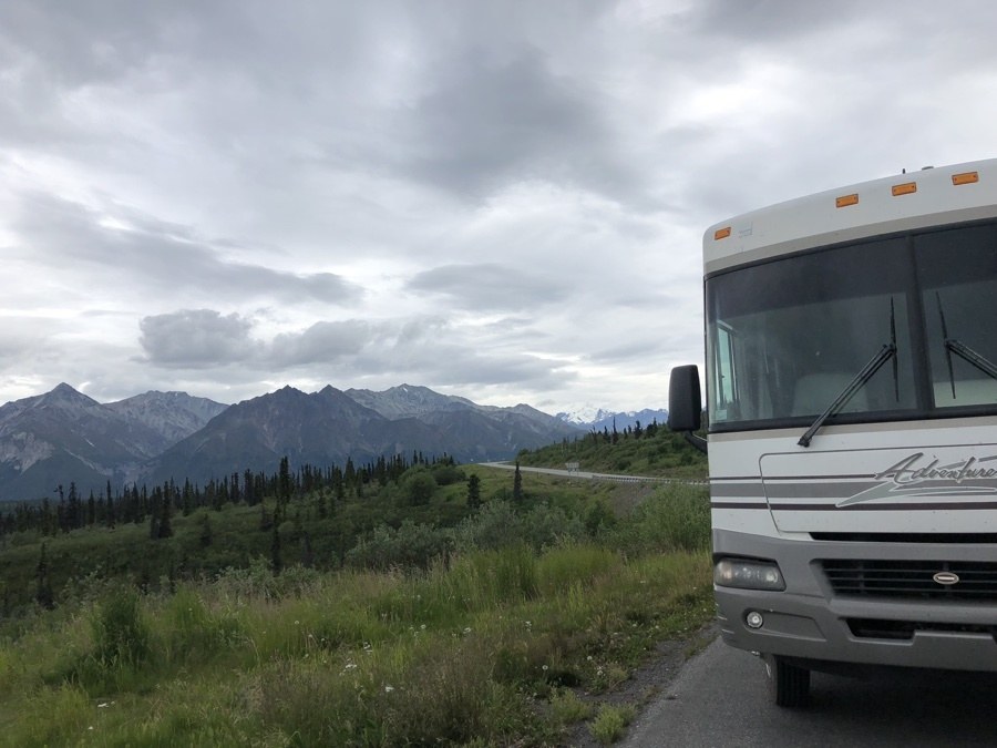 rv and mountains in a pullout in alaska.