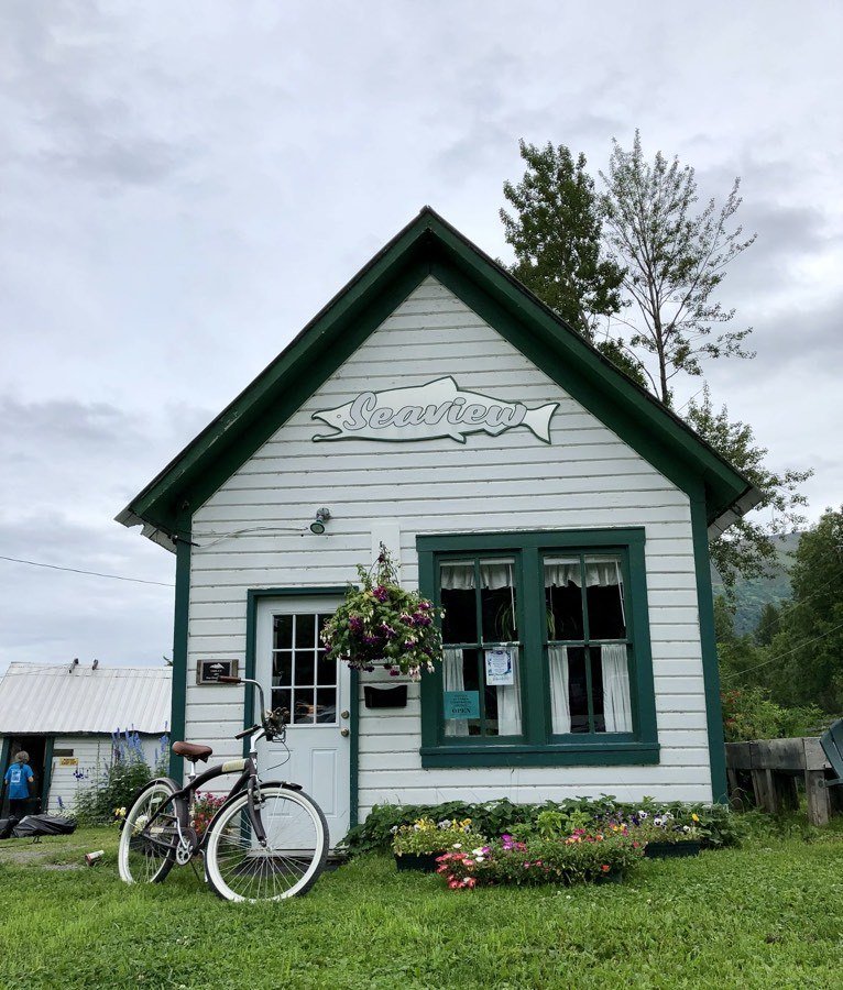 cute cottage with a bike out front in hope alaska.