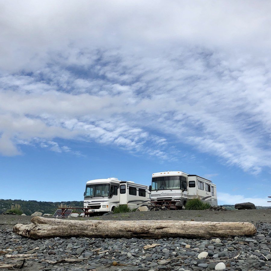 2 motorhomes parked at Mariner Park Campground on the Homer Spit.