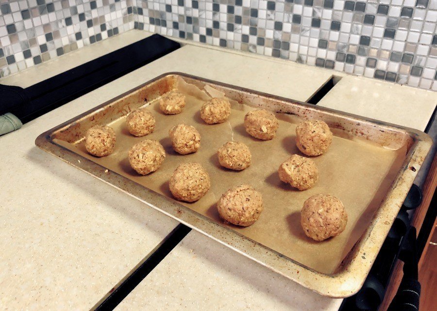 vegan meatballs on a baking sheet.