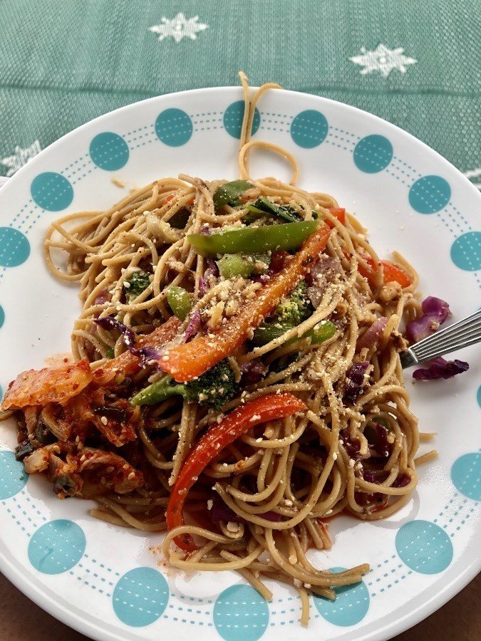 kung pao style noodles on a plate.