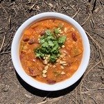 african sweet potato and peanut stew in a white bowl.