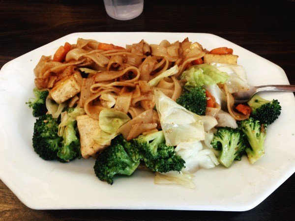 a plate of pad se yu noodles from red curry vegan kitchen in flagstaff, arizona.
