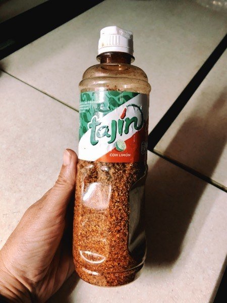 a bottle of tajin original chili seasoning.